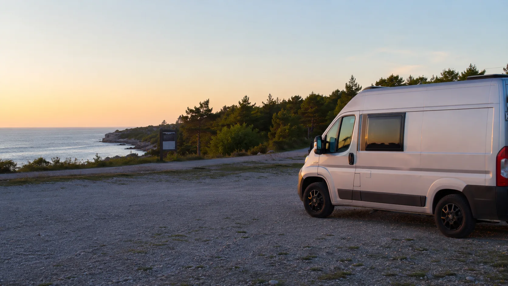 A campervan at an organised Gotland coastal parking area while planning the next night