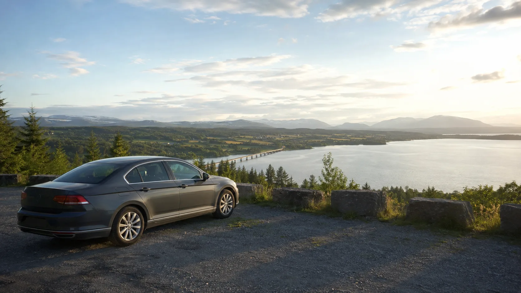 A car overlooking Lake Storsjön and the Jämtland mountains